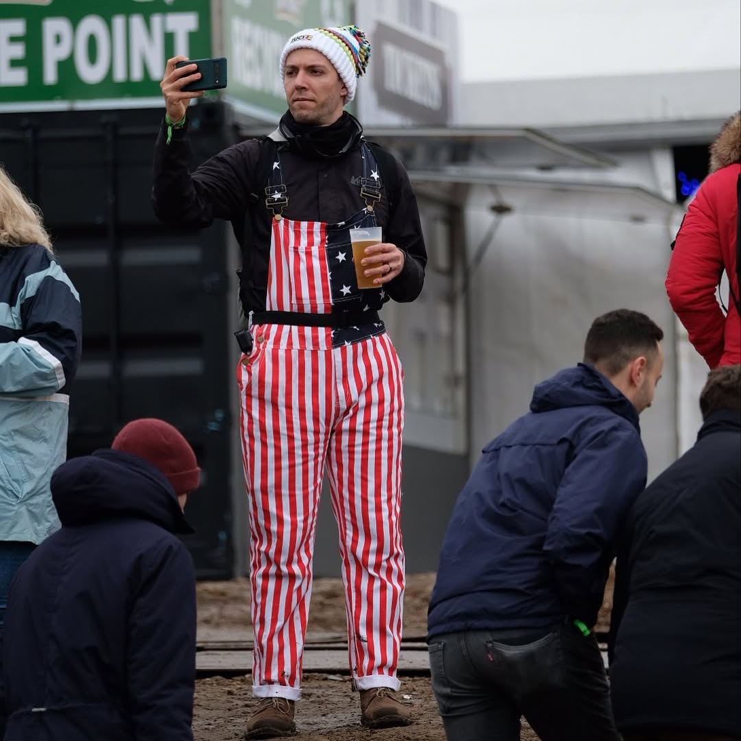 a cycling fan taking a photograph 