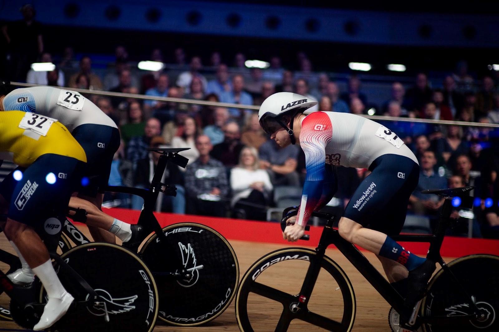 track cyclists riding in the velodrome