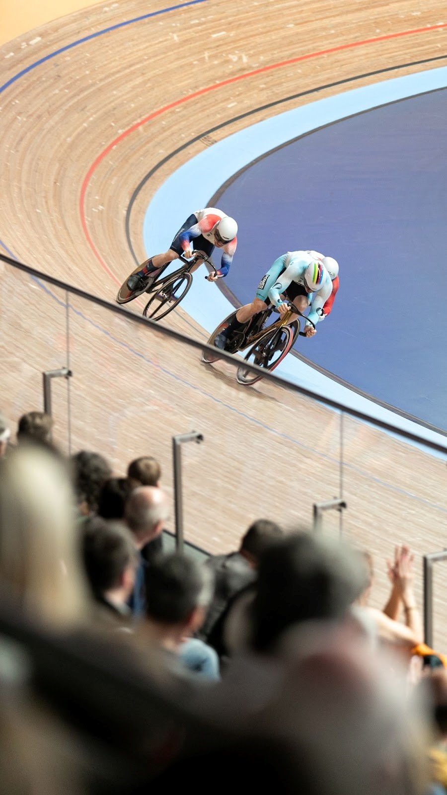 three track cyclsists sprinting for the line